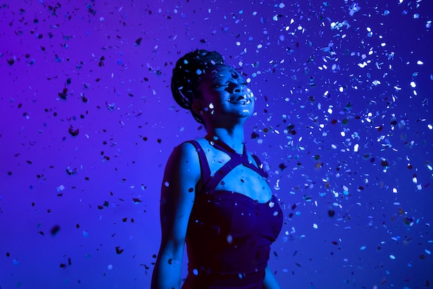 Woman posing with confetti side view