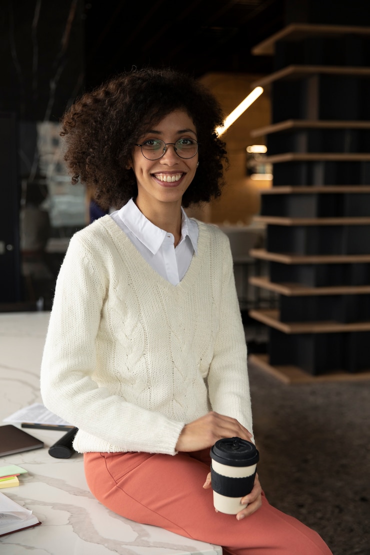 Free Photo woman posing with a cup of coffee