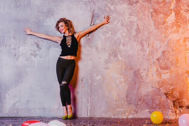 Woman posing with hands apart