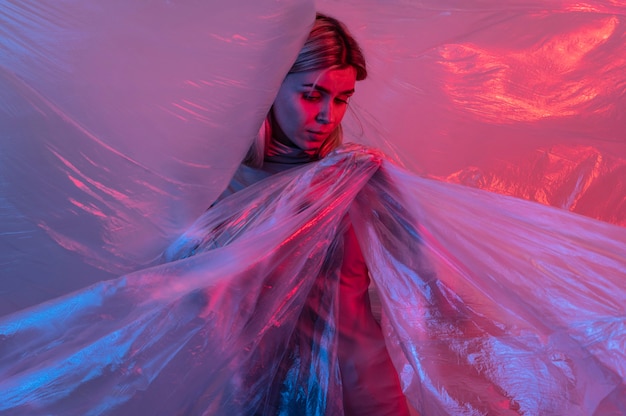 Woman posing with plastic foil