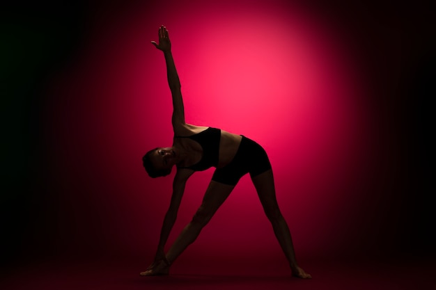 Woman posing with red light full shot