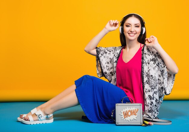 Woman posing with stylish footwear summer fashion and bag