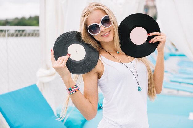 Woman posing with vinyl records 