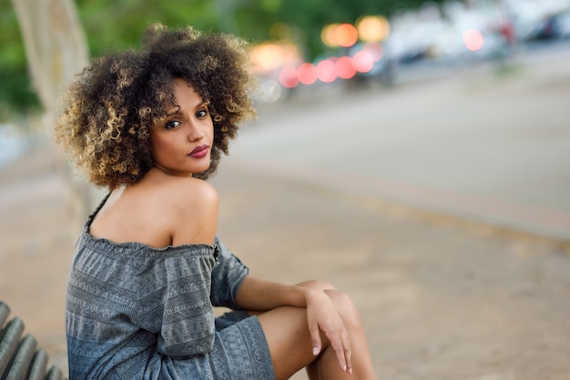 Free photo woman posing on a wooden bench