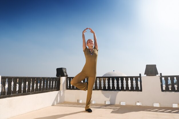 Woman practicing yoga dancing