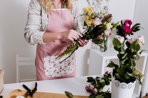 Woman preparing bunch in shop