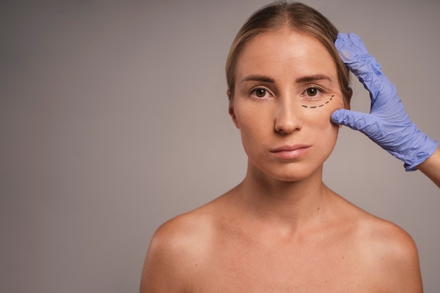 Free photo woman preparing for cosmetic surgery