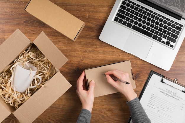 Free photo woman preparing a cyber monday box