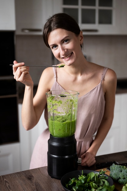 Woman preparing her juice recipe