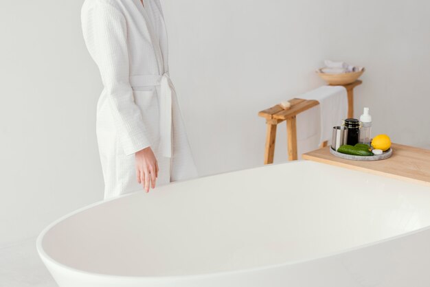 Woman preparing a relaxing bath