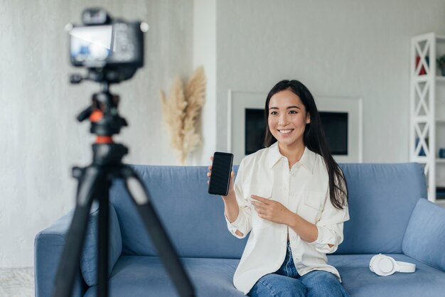 Woman presenting her phone in a live stream