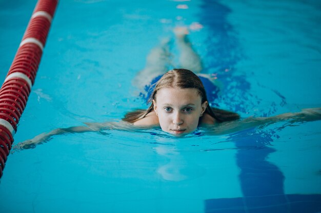 Woman professional swimmer in swimming pool