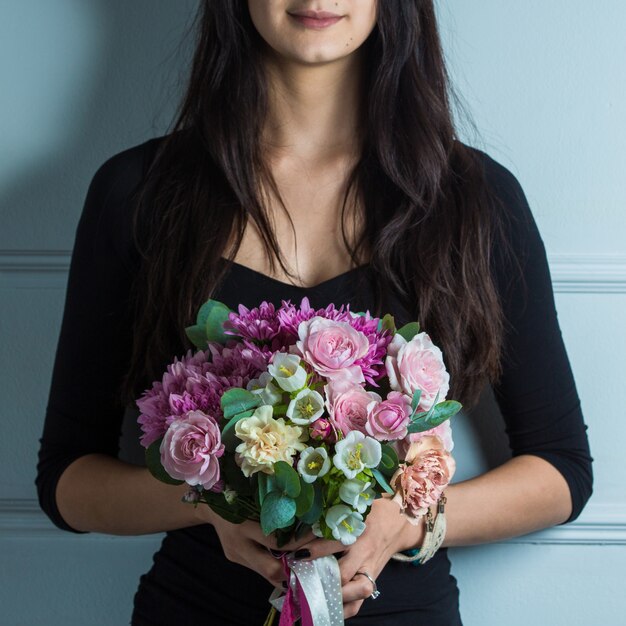 Woman promoting bridal flower bouquet