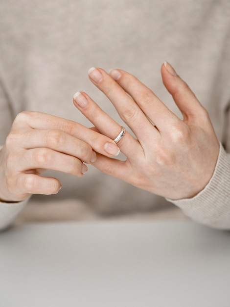 Woman pulling out marriage ring