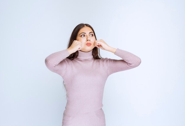 woman in purple shirt giving relaxed and appealing poses.