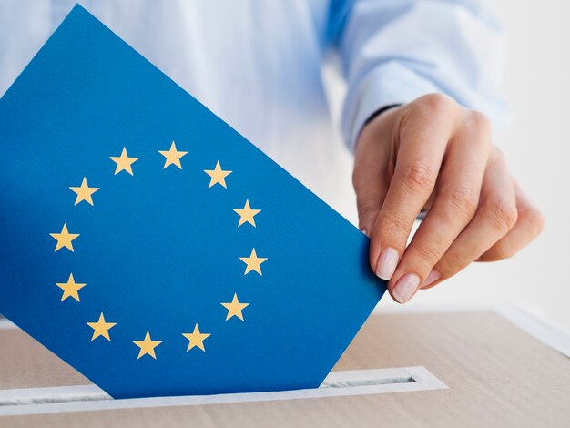 Woman putting an european union envelope in a box