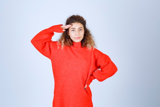 woman putting hand to her forehead and observing. 