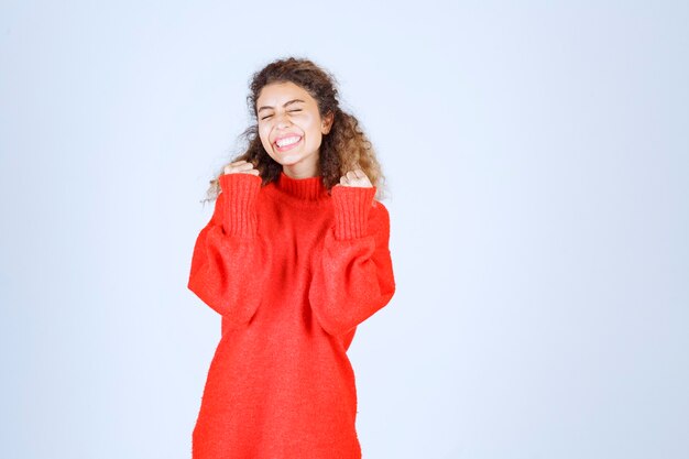 woman raising her fists and feeling successful. 