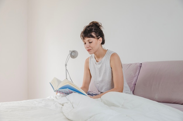 Woman reading book in the morning