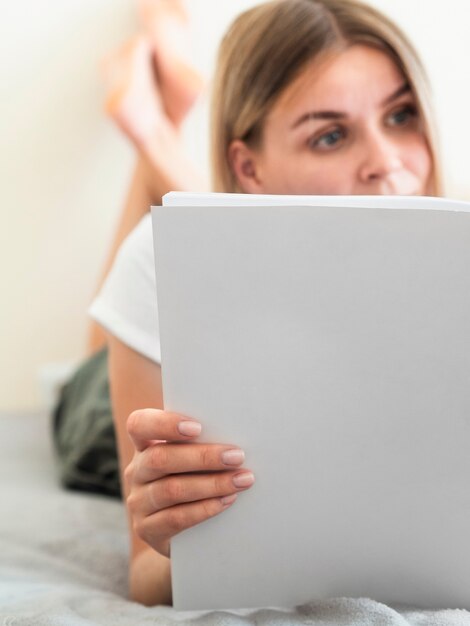 Woman reading a mock-up magazine