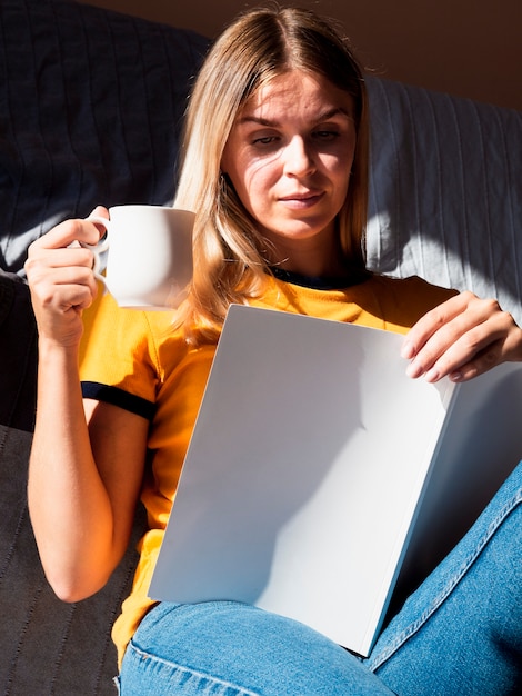 Woman reading a mock-up magazine