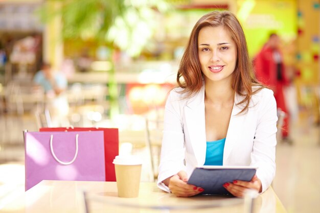 Woman reading news while resting