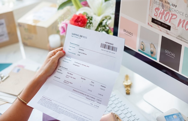 Free photo woman reading payment bill