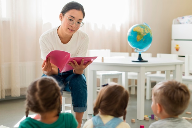 Free photo woman reading something for her students