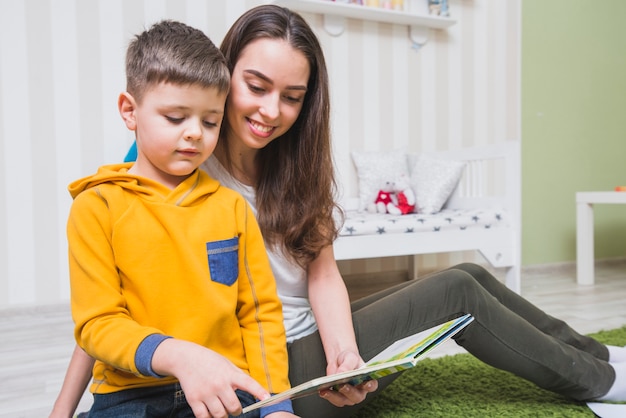 Woman reading stories with boy