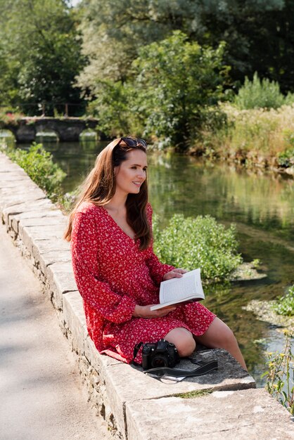 Woman reading while traveling alone