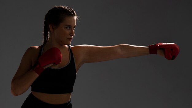 Woman ready to punch with box gloves