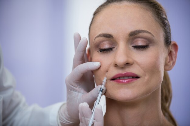 Woman receiving botox injection