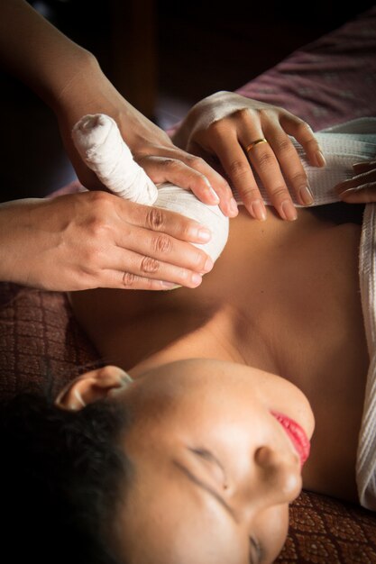 Woman receiving a massage on the clavicle