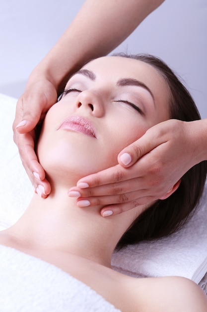 Woman receiving massage on a spa center
