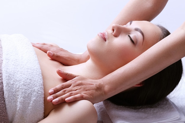 Woman receiving massage on a spa center