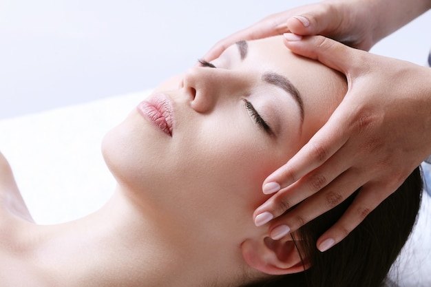 Woman receiving massage on a spa center