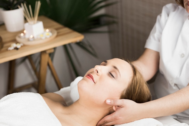 Free photo woman receiving massage in spa center