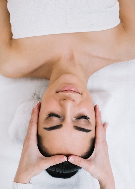 Woman receiving a relaxing facial massage