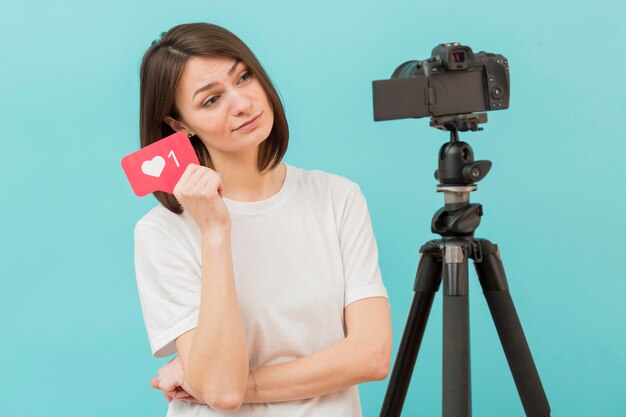 woman recording for personal blog at home