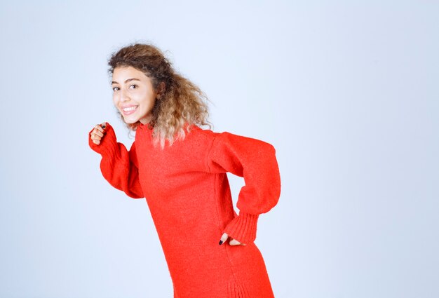 Free photo woman in red shirt running and escaping.