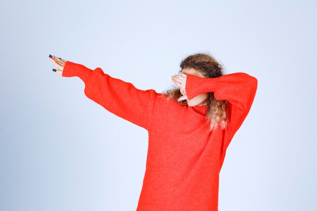 woman in a red shirt stopping and preventing something. 