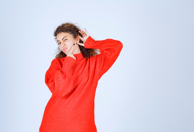 Free photo woman in red sweatshirt meaning her smile.