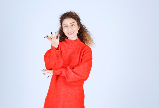 woman in red sweatshirt meaning her smile. 