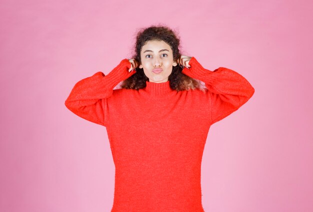 woman in red sweatshirt meaning her smile. 