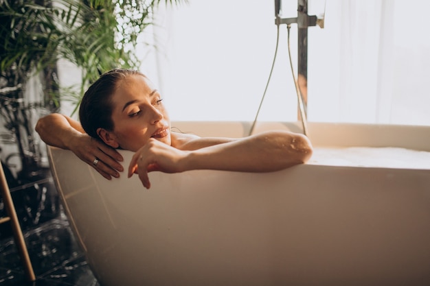 Woman relaxing in bath with bubbles