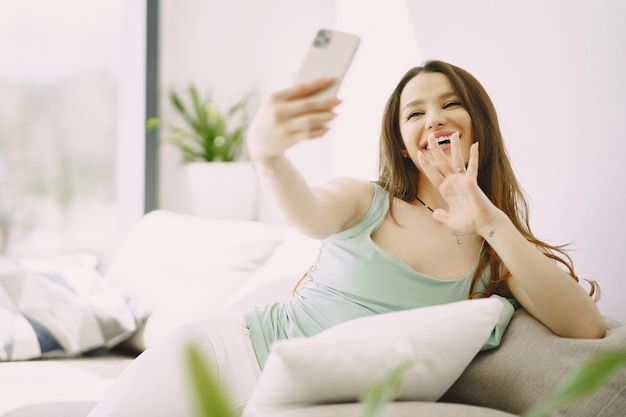 Woman relaxing on comfortable couch at home