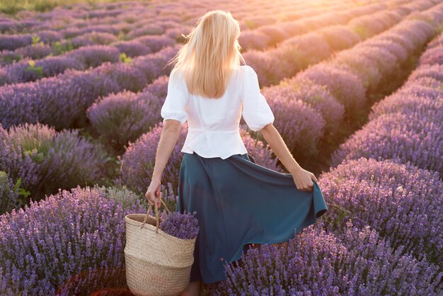 Woman relaxing in flower field