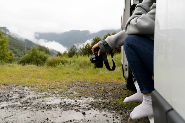 Free photo woman relaxing in her camper in daylight