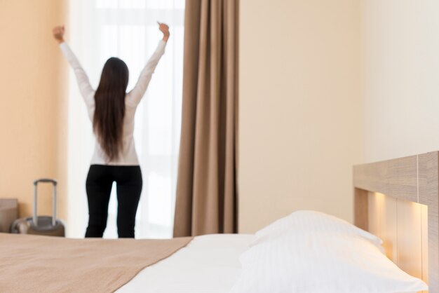 Woman relaxing in hotel room