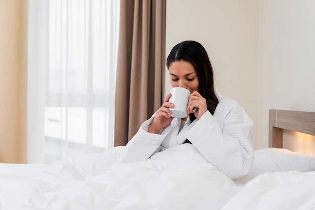 Woman relaxing in hotel room